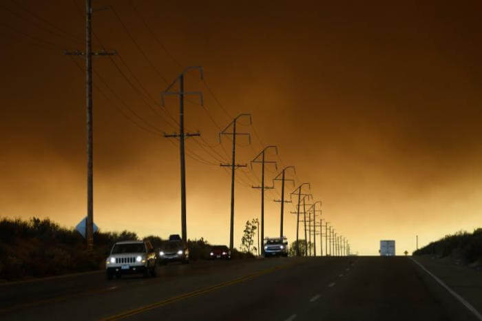 Thick smoke from the so-called Bluecut Fire fills the sky near the San Bernardino National Forest in San Bernardino County, California, U.S. August 16, 2016.