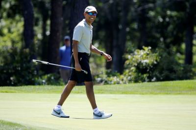 U.S. President Barack Obama smiles after putting on the first green at Farm Neck Golf Club during his annual summer vacation on Martha's Vineyard, in Oak Bluffs, Massachusetts, U.S. August 7, 2016.