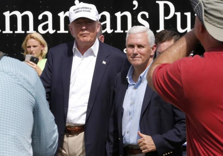 Republican presidential nominee Donald Trump and Republican U.S. vice presidential candidate Mike Pence speak with flood victims outside Greenwell Springs Baptist Church in Central, Louisiana, August 19, 2016.