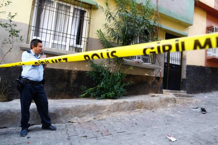 A police officer secures the scene of an explosion where a suspected suicide bomber targeted a wedding celebration in the Turkish city of Gaziantep, Turkey, August 21, 2016.