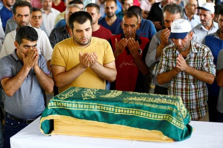 Family members of Sehriban Nurbay, a 3-month-old victim of a suicide bombing at a wedding in Gaziantep, attend her funeral ceremony in the southern Turkish city of Gaziantep, Turkey, August 21, 2016.