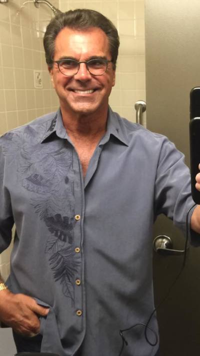 Carman Licciardello poses in a hospital bathroom after doctors visit, August 2016.