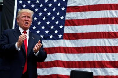 Republican presidential nominee Donald Trump stands onstage during a campaign rally in Akron, Ohio, August 22, 2016.