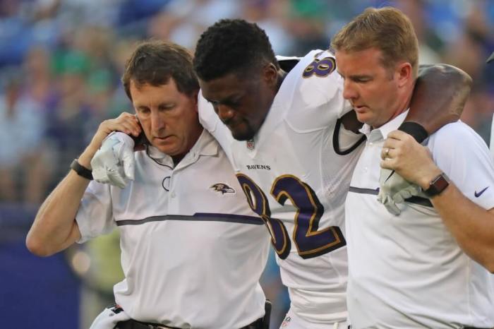 Baltimore Ravens tight end Ben Watson (82) is assisted off the field after suffering a torn right Achilles tendon against the Detroit Lions at M&T Bank Stadium in Baltimore, Maryland, August 27, 2016.