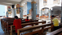 Faithful Flock to Church in Devastated Philippines, Offering Prayers for the Dead and Thanks for Their Lives