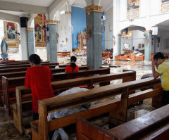 Faithful Flock to Church in Devastated Philippines, Offering Prayers for the Dead and Thanks for Their Lives