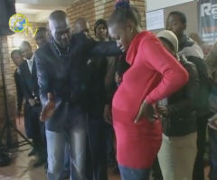 South African Pastor Makes Members Eat Grass; Watch Him Command Demon Out of Woman's Stomach