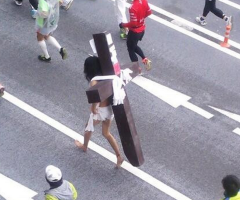'Jesus' With Cross Strapped to Back Runs Yet Another Marathon
