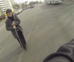 Watch This Motorcyclist Rescue an Elderly Man Struggling to Cross a Busy Street (VIDEO)