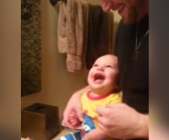 You'll Crack Up Watching This Dad Try to Brush His Baby Boy's Teeth (VIDEO)