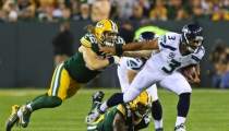 Aaron Rodgers Takes Jab at Russell Wilson, Says 'God Is a Packers Fan'