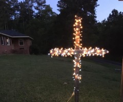 'Faith over fear' campaign featuring crosses with Christmas lights in yards spreads across nation 