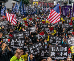 Hong Kong police raid pro-democracy newspaper on ‘the day press freedom died’ 