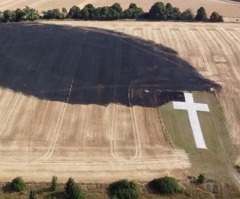 Lenham memorial cross unscathed by field fire that scorched ground during UK heatwave