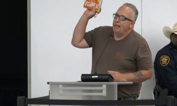 Texas school board forcibly removes protester who slammed library book for 'homosexuality and satanism'