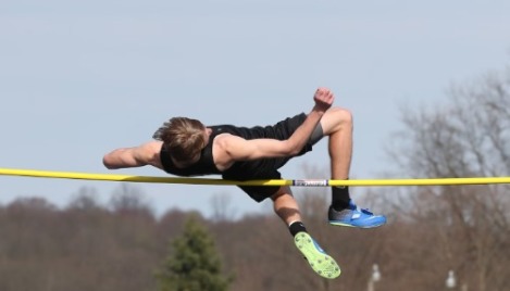 Male athlete takes first place in girls' high jump championship meet
