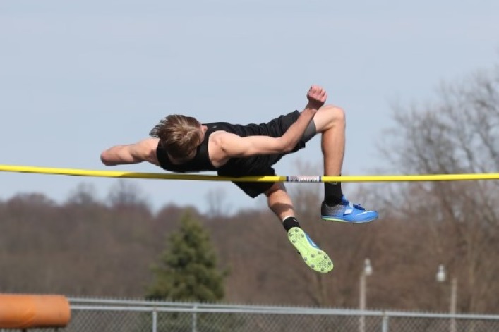 Male athlete takes first place in girls' high jump championship meet