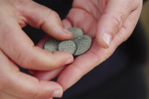 Archeologists discover rare 2nd century coin with Hebrew inscription in Judean Desert