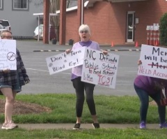 Protesters want voucher funding stripped from church school over pastor's comments on rape