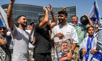 Hostage families caravan to Gaza border, breach fence, call out to loved ones with loudspeakers