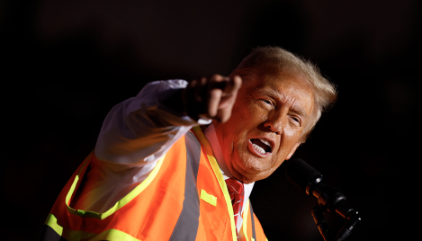 Trump trolls Harris, Biden with garbage truck press conference