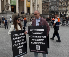 Belgian police arrest, strip search Billboard Chris, ADF staffer for holding signs defending kids