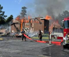 Members praise God in tents after fire destroys historic black church in South Carolina