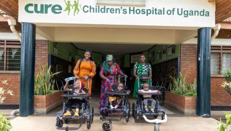 Christian ministries deliver the Gospel, over 200 wheelchairs to disabled Ugandan children