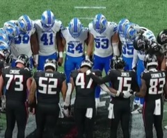 Lions, Falcons huddle in prayer as ambulance takes injured Morice Norris off field