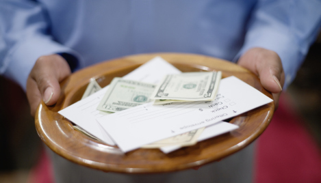 Episcopal priest charged with stealing $300K fights removal from priesthood