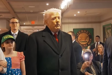 Trump prays with supporter during campaign stop in Iowa
