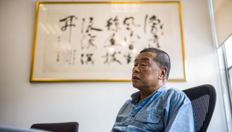 Hong Kong pro-democracy media tycoon Jimmy Lai sentenced to 20 years in prison