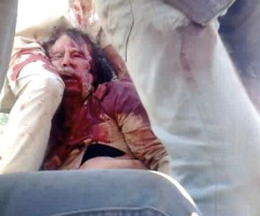 Gaddafi Dead: Contradicting Reports Emerge on Dictator's Cause of Death (PHOTOS)