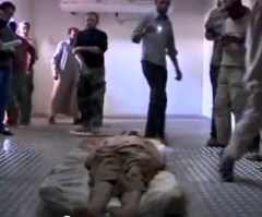 Gaddafi Dead: Video Emerges of Body in Meat Locker as Officials Dispute Burial (PHOTO)