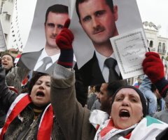 Syrian President Denies Role in Massacre of Over 100 Civilians