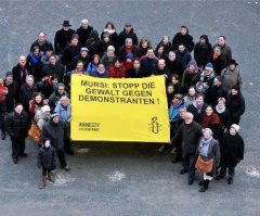 Amnesty International Protests Against Egypt's President Morsi During Germany Visit